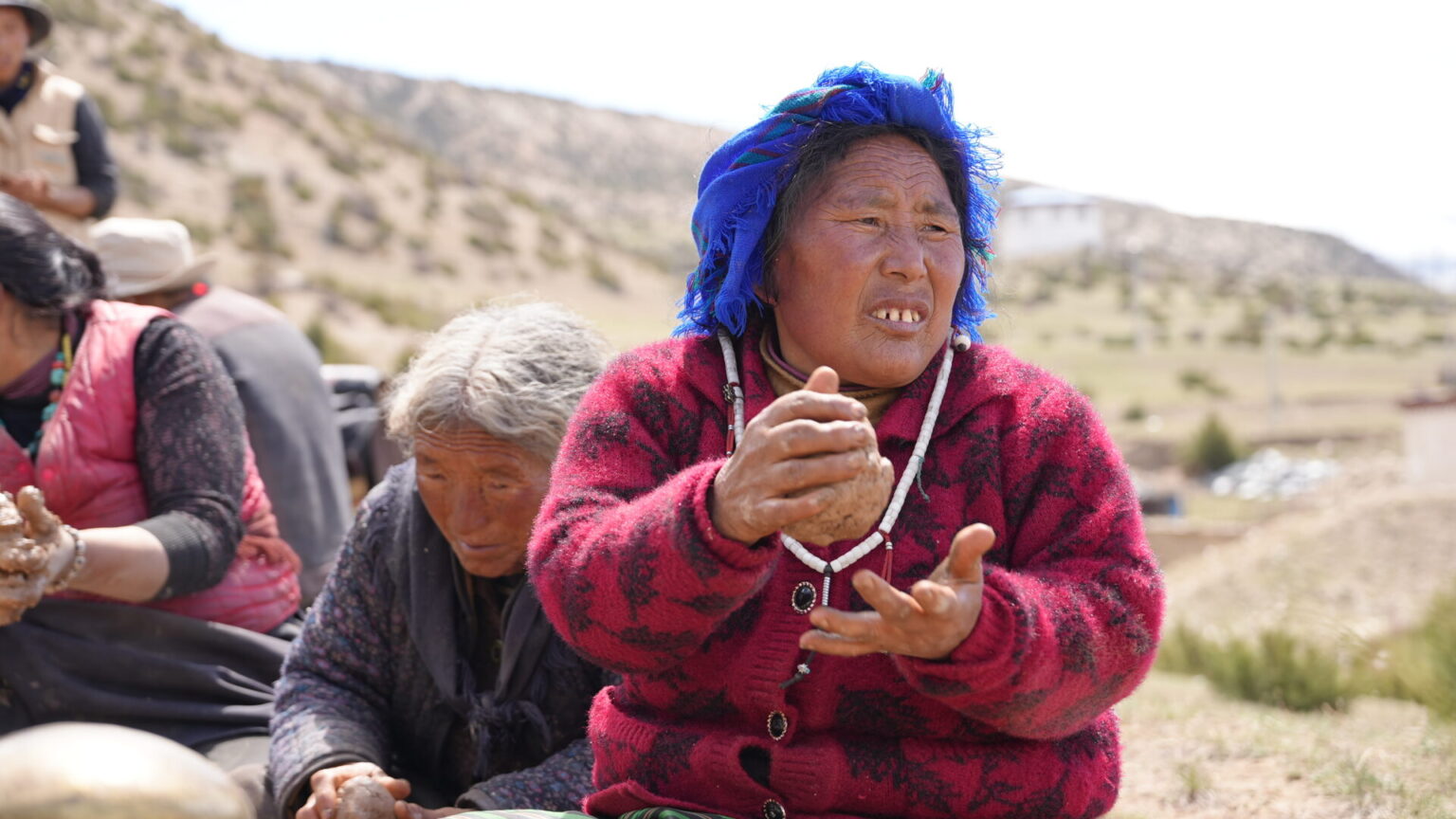 Locals forming clay figures
