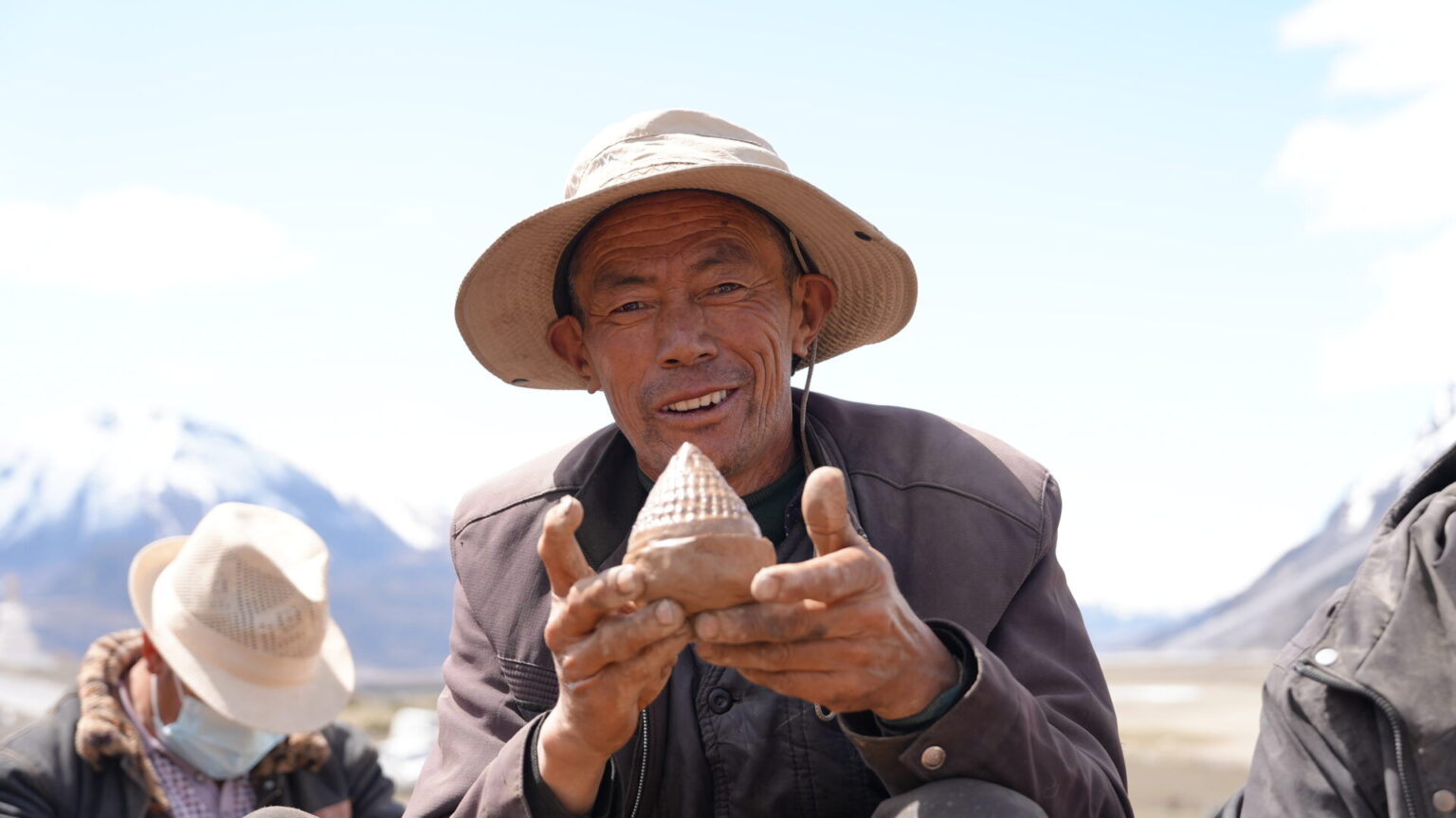 Locals forming clay figures